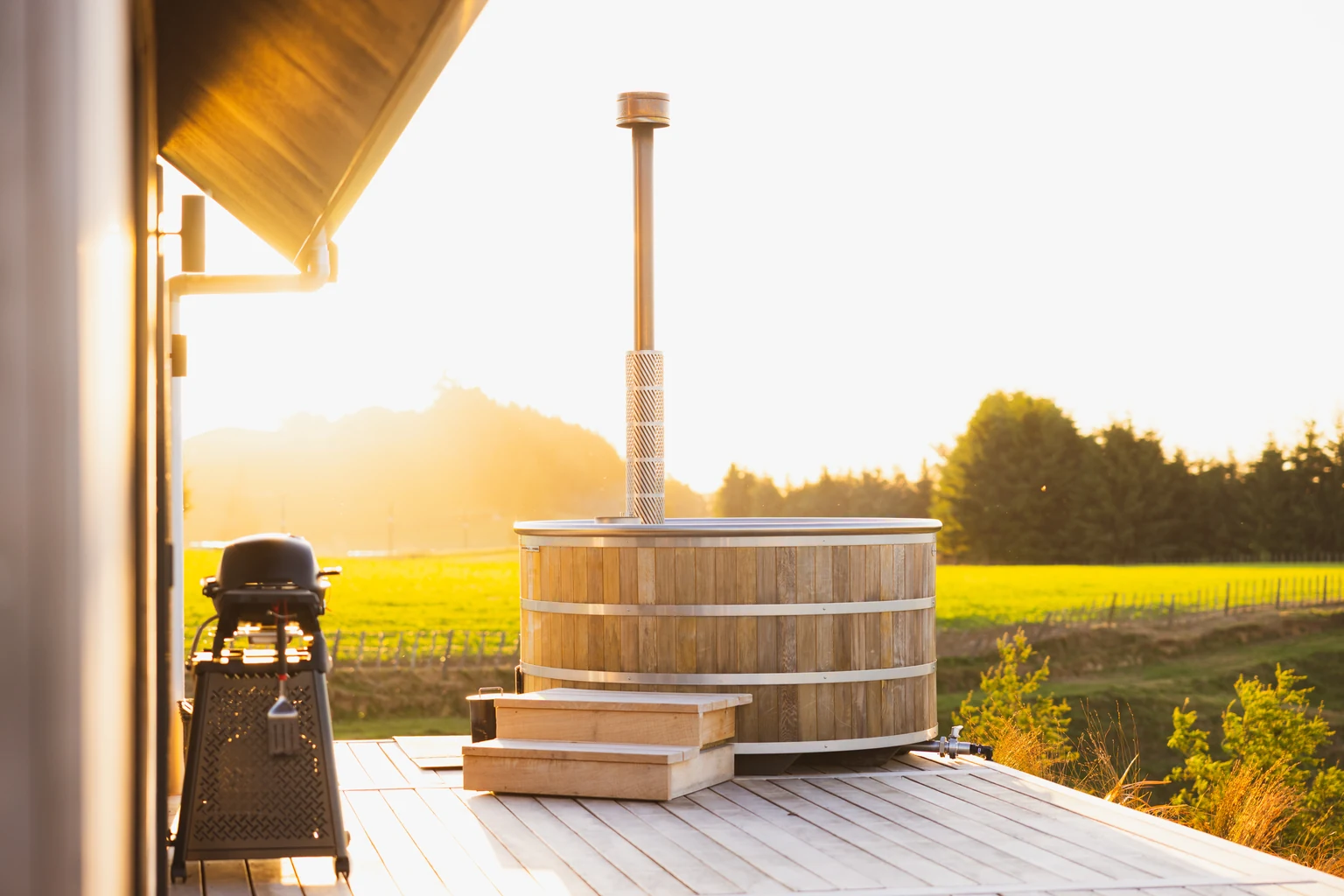 Wood-fired Stoked hot tub at sunset